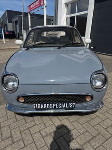 Hele leuke Nissan Figaro in Lapisgrijs met lage KM stand!