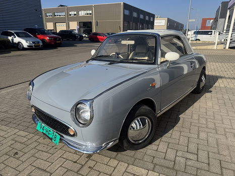 Hele leuke Nissan Figaro in Lapisgrijs met lage KM stand! - 2