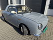 Hele leuke Nissan Figaro in Lapisgrijs met lage KM stand! - 5 - Thumbnail