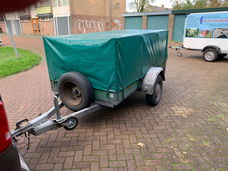 Anssems aanhanger bagagewagen met huif bakmaat 251 bij 131 (cm) met reservewiel